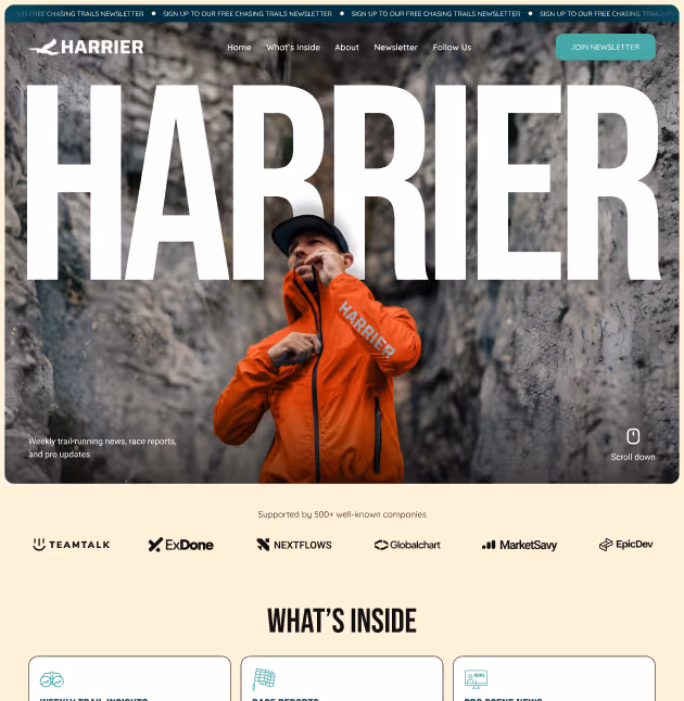 Person in an orange Harrier jacket adjusting the collar, standing between rocky cliffs with large HARIER text overlay.