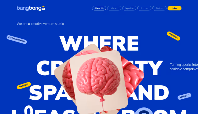 Creative venture studio homepage with large text 'WHERE CREATIVITY SPARKS AND LEAPS ROOM' and images of pink brains on cards floating over a blue background.